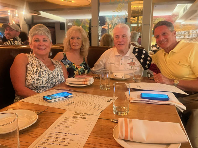 Susan. Cathy. Tommy. and Doug enjoying dinner.